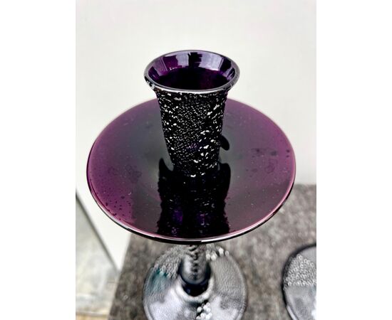 Pair of dark amethyst glass candlesticks with inclusion of silver leaf.Murano.     