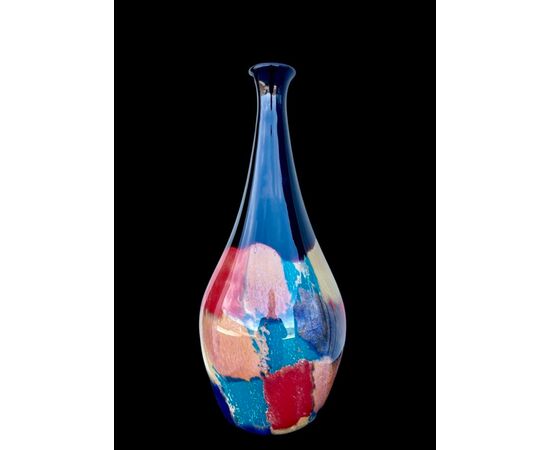Vase in heavy submerged glass with inclusions in polychrome tesserae and stains of metal oxides.Manifattura Toso.Murano.     