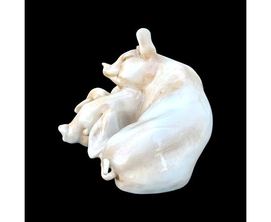 Porcelain sculpture of a pair of crouching pigs. Tay Manufacture (Giuseppe Tagliarol).     