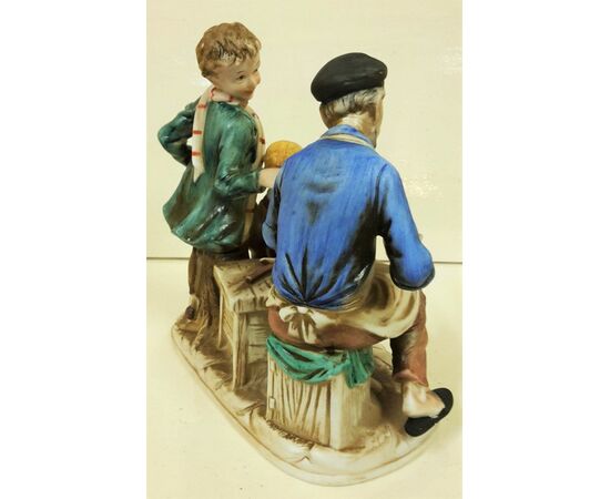 Calzolaio con bambini in ceramica dipinto a mano
