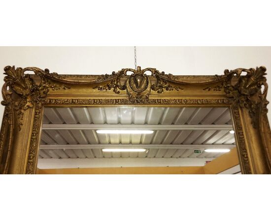 Mirror in restored gilded plaster