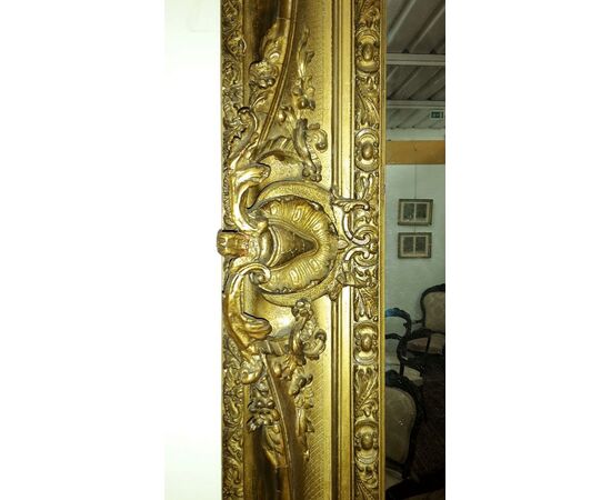 Mirror in restored gilded plaster