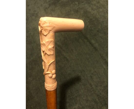Stick with ivory handle with high relief with plant motifs.     