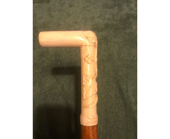 Stick with ivory handle with high relief with plant motifs.     