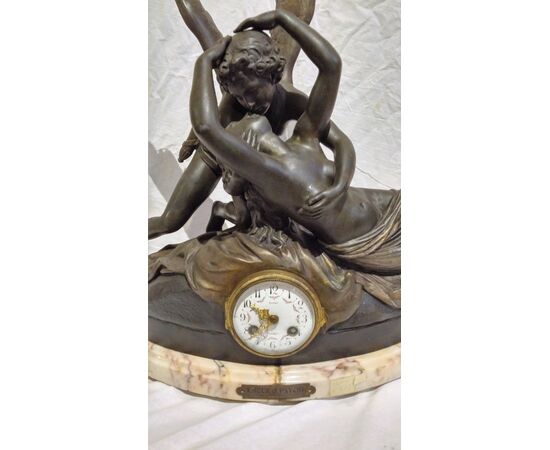 Antimony table clock and marble base depicting "Amour et Psyche"