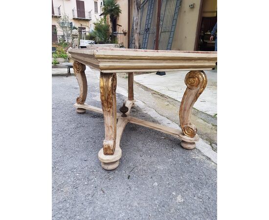 Low table in lacquered and gilded wood with top in scagliola plaster inlaid with porphyry and malachite. Italy 19th century