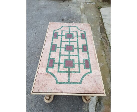 Low table in lacquered and gilded wood with top in scagliola plaster inlaid with porphyry and malachite. Italy 19th century