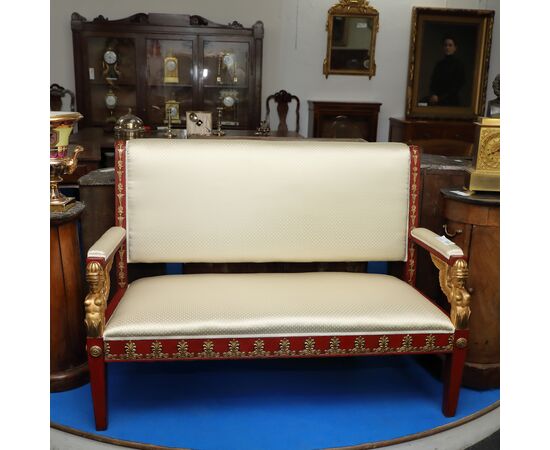 Sofa in Pompeian red and gilded lacquered wood     