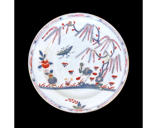 Majolica plate with &#39;ostrich&#39; decoration and gold highlights.Manufactured by Felice Clerici.Milan.     