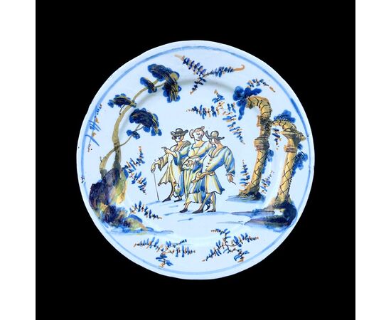 Majolica plate decorated with characters and architectures, Savona or Albisola, touch, arrow and asterisk mark.     