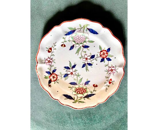 Majolica plate with floral decoration in embossed enamels called &#39;barbottina.Manufactured by Pasquale Rubati.Milan.     