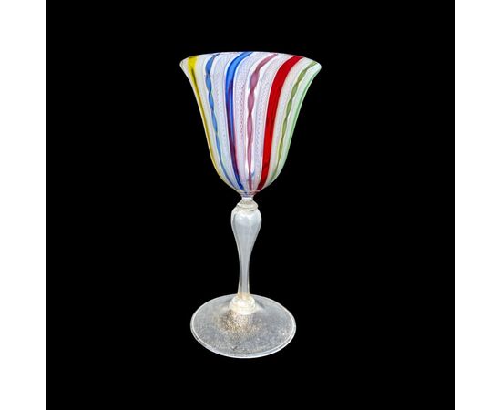 Goblet in zanfirico and aventurine polychrome glass with gold leaf. A.Ve.M Murano manufacture.     