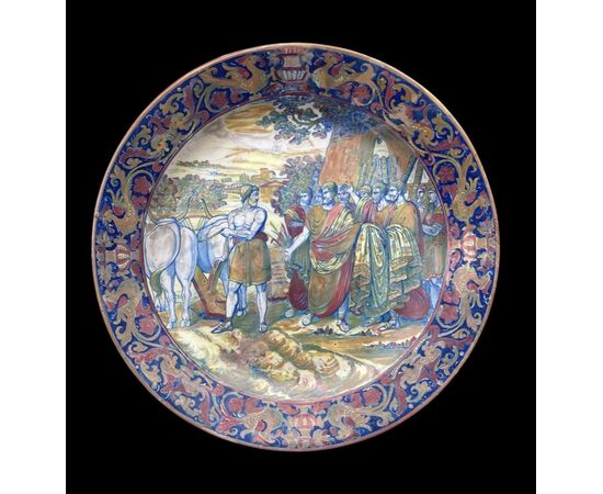 Metallic luster majolica plate with Raphaelesque motifs on the brim and decorated scene with characters in the cavetto.Alfredo Santarelli.Gualdo Tadino.     