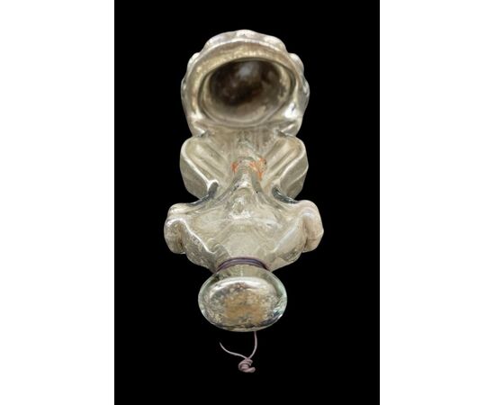 Holy water stoup in blown glass with internal silver plating and figure of Christ in relief.Murano.     