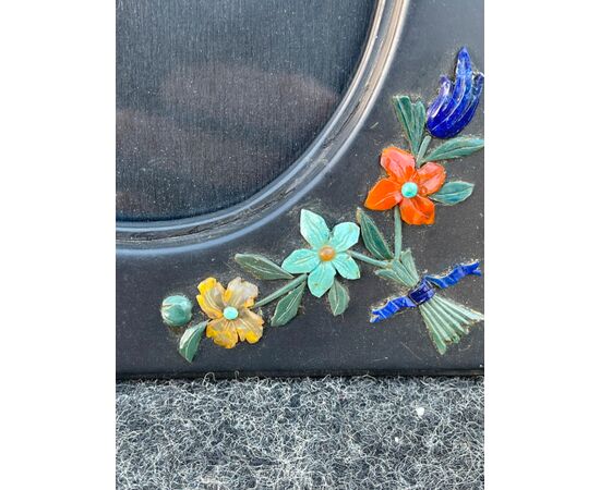 Chalkboard stone frame with micromosaic floral motifs in semi-precious stones in relief. Florence.     