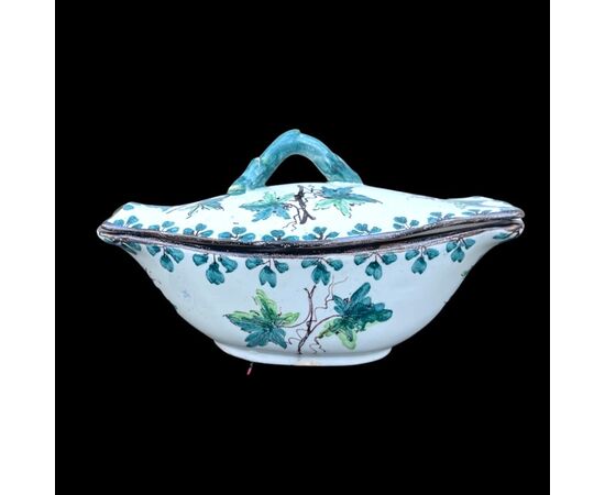 &#39;Boat&#39; majolica gravy boat with twisted branch grip and vine leaf decoration.Ferniani manufacture, Faenza.     