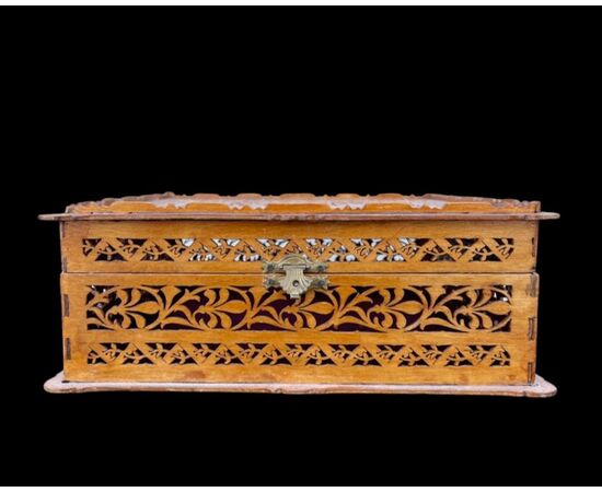 Openwork softwood box with stylized neoclassical, vegetal and geometric characters motif Italy.     