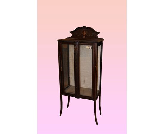 Victorian display cabinet from the late 1800s with paintings     