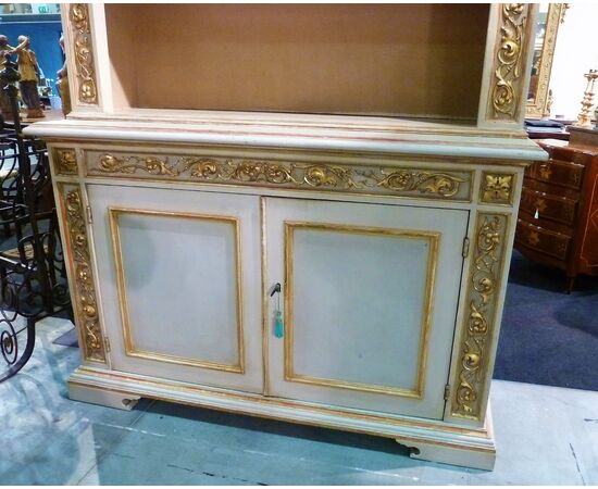LACQUERED BOOKCASE WITH GOLDEN FRIEZES Lacquered and gilded bookcase     
