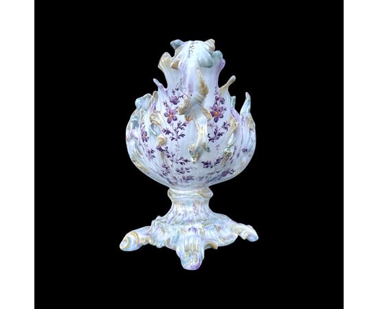Centerpiece vase in majolica with two handles in the shape of a stylized leaf and rocaille moves with polychrome floral decoration. Antonibon manufacture. Nove di Bassano.     