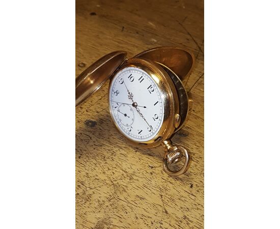 Cronografo in oro rosso 18 K.